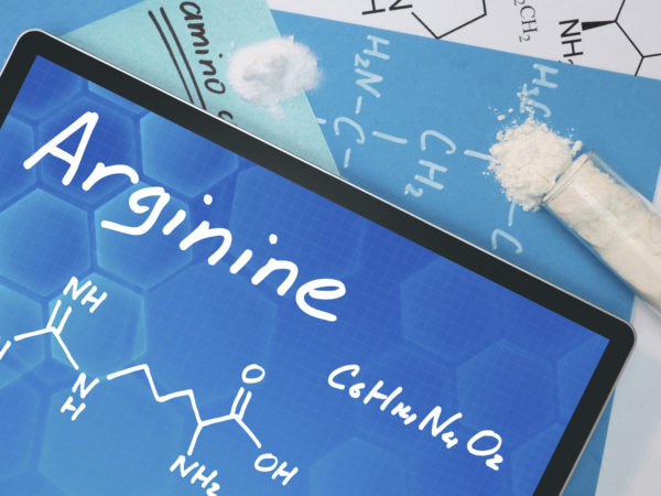 Tablet with the chemical formula of Arginine . Amino acids.