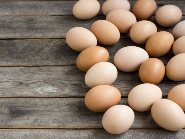 Brown eggs on the wooden grey table