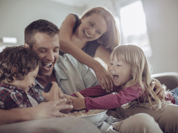 Close up of a happy young family having good time together.