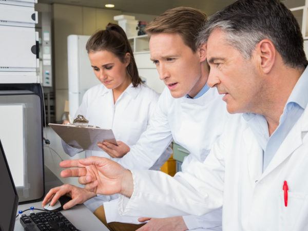Team of scientists working together at the laboratory